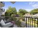 Private balcony with city views and seating area at 222 Glenwood Ave # 307, Raleigh, NC 27603
