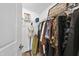 Walk-in closet with hanging rods and additional shelving at 222 Glenwood Ave # 307, Raleigh, NC 27603