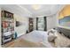 Main bedroom with king-size bed, large windows, and wood floors at 222 Glenwood Ave # 307, Raleigh, NC 27603