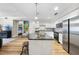 Open concept kitchen with granite island and stainless steel appliances at 222 Glenwood Ave # 307, Raleigh, NC 27603