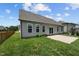 Home's backyard with patio and grassy area at 135 Glenfield Ln, Burlington, NC 27215