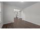 Light-filled hallway with hardwood floors and views into adjacent rooms at 135 Glenfield Ln, Burlington, NC 27215