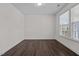 Simple office space with hardwood floors and large window at 135 Glenfield Ln, Burlington, NC 27215