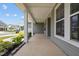 Covered front porch with white columns and views of neighborhood at 135 Glenfield Ln, Burlington, NC 27215
