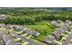 Neighborhood view with a mix of houses and green spaces at 135 Glenfield Ln, Burlington, NC 27215