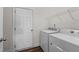 Laundry room with washer, dryer, and shelving at 135 Glenfield Ln, Burlington, NC 27215
