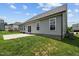 Gray house with backyard patio and lawn at 135 Glenfield Ln, Burlington, NC 27215