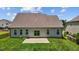 Two-story house with gray siding and a large backyard at 135 Glenfield Ln, Burlington, NC 27215