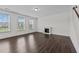 Spacious living room with hardwood floors, fireplace and large windows at 135 Glenfield Ln, Burlington, NC 27215
