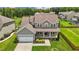 Two-story house with gray siding, white garage door, and fenced backyard at 135 Glenfield Ln, Burlington, NC 27215
