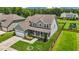 Two-story house with gray siding, white garage door, and a landscaped yard at 135 Glenfield Ln, Burlington, NC 27215