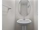Small bathroom with pedestal sink and oval mirror at 135 Glenfield Ln, Burlington, NC 27215