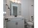 Clean bathroom with white vanity, subway tile, and a bathtub at 16 Autumn Breeze Ct, Angier, NC 27501