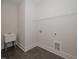 Laundry room with utility sink and shelving at 16 Autumn Breeze Ct, Angier, NC 27501