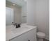 Modern bathroom with white vanity, black fixtures, and a toilet at 16 Autumn Breeze Ct, Angier, NC 27501