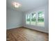 Bright bedroom with hardwood floors and treetop views at 16 Autumn Breeze Ct, Angier, NC 27501