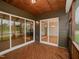 Screened porch with access to kitchen and dining area at 16 Autumn Breeze Ct, Angier, NC 27501