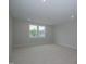 Bright bedroom featuring carpet and a large window at 16 Autumn Breeze Ct, Angier, NC 27501
