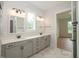 Elegant bathroom with double vanity and access to bedroom at 16 Autumn Breeze Ct, Angier, NC 27501