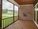 Relaxing screened porch with stone fireplace at 16 Autumn Breeze Ct, Angier, NC 27501
