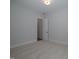 Well-lit bedroom featuring carpeted floors and access to a bathroom at 16 Autumn Breeze Ct, Angier, NC 27501