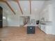 Kitchen island with sink and breakfast bar overlooking Gathering room at 16 Autumn Breeze Ct, Angier, NC 27501