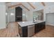 Open kitchen with island, stainless steel dishwasher and view into Gathering room at 16 Autumn Breeze Ct, Angier, NC 27501