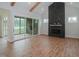 Gathering room with sliding doors to deck and modern fireplace at 16 Autumn Breeze Ct, Angier, NC 27501
