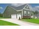 House exterior with two-car garage and landscaping at 16 Autumn Breeze Ct, Angier, NC 27501