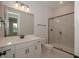 Bathroom with white vanity, marble shower, and modern fixtures at 16 Autumn Breeze Ct, Angier, NC 27501
