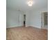 Large bedroom with hardwood floors and access to bathroom at 16 Autumn Breeze Ct, Angier, NC 27501