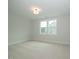 Well-lit bedroom with carpet and a double window at 16 Autumn Breeze Ct, Angier, NC 27501