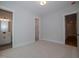 Charming bedroom with carpet, multiple entrances, and views of the hallway at 16 Autumn Breeze Ct, Angier, NC 27501