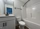 Clean bathroom with tub, toilet and white vanity at 156 S Mistflower St, Clayton, NC 27520