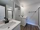 Modern bathroom with white vanity and walk-in shower at 156 S Mistflower St, Clayton, NC 27520