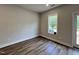 Spacious bonus room with hardwood floors and large window at 156 S Mistflower St, Clayton, NC 27520