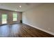 Bright bonus room with wood-look floors and access to a deck at 156 S Mistflower St, Clayton, NC 27520