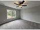 Spacious bedroom with carpet and a large window at 156 S Mistflower St, Clayton, NC 27520