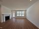 Spacious living room with hardwood floors and fireplace at 1220 Porters Call Dr, Wendell, NC 27591