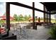 Relaxing outdoor patio with tables, chairs, and umbrellas at 1220 Porters Call Dr, Wendell, NC 27591