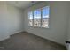 Charming bedroom with a window showcasing a neighborhood view at 1220 Porters Call Dr, Wendell, NC 27591