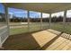 Spacious screened porch overlooking a pond and lush landscape at 1220 Porters Call Dr, Wendell, NC 27591