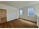 Spacious bedroom with hardwood floors and access to another room at 1220 Porters Call Dr, Wendell, NC 27591
