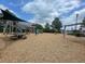 Community playground with swings and play structure at 1220 Porters Call Dr, Wendell, NC 27591