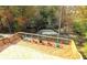 Elevated deck overlooking a wooded area with a stream at 1220 Porters Call Dr, Wendell, NC 27591