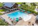 Community pool with a large deck, plenty of lounge chairs and umbrellas at 1220 Porters Call Dr, Wendell, NC 27591