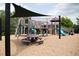 Wooden playground structure with shade sail at 1220 Porters Call Dr, Wendell, NC 27591