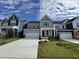 Two story home with gray siding and white garage door at 1220 Porters Call Dr, Wendell, NC 27591