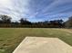 Large backyard with grassy area and concrete pad at 175 W Saltgrass Ln, Smithfield, NC 27577