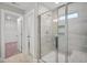 Bright bathroom featuring a walk-in shower and built-in shelving at 81 Eagle Crest Ct # Apex Craftsman, Lillington, NC 27546